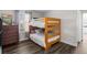 Comfortable bedroom with bunkbeds and a view of the yard through the window at 12119 S Wanderlust Way, Parker, CO 80138