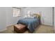 Cozy bedroom with a queen bed, soft carpet, and a natural color palette at 12119 S Wanderlust Way, Parker, CO 80138