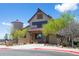 Exterior shot of a charming building with barn doors, a silo and well-maintained landscaping at 12119 S Wanderlust Way, Parker, CO 80138