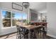 Dining area featuring rustic wood table and chairs in front of picture window at 12119 S Wanderlust Way, Parker, CO 80138