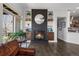 Cozy living room with fireplace, built-in shelves, and sliding door to the outdoor patio at 12119 S Wanderlust Way, Parker, CO 80138