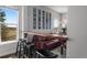 Living room seating area with leather sofa, breakfast bar and view of outdoor scenery at 12119 S Wanderlust Way, Parker, CO 80138