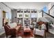Bright living room featuring beautiful built-ins, comfortable seating, and lots of natural light at 12119 S Wanderlust Way, Parker, CO 80138