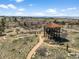 Aerial view of a wooden observation tower surrounded by hiking trails, offering panoramic views at 12119 S Wanderlust Way, Parker, CO 80138