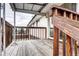 Back deck with wood railings and steps leading to the backyard at 301 S Troy St, Aurora, CO 80012