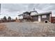 Spacious backyard with deck, fence, and patio at 301 S Troy St, Aurora, CO 80012