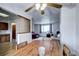 View of the dining room with a wood table and chairs leading to a living area with comfortable seating at 301 S Troy St, Aurora, CO 80012
