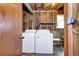 Functional laundry room with washer and dryer hookups, featuring lots of room for storage at 301 S Troy St, Aurora, CO 80012