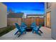 Charming backyard patio with fire pit and Adirondack chairs, perfect for outdoor entertaining at 3928 Vrain St, Denver, CO 80212