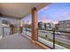 An outdoor balcony with brick supports shows a peaceful neighborhood setting at dusk at 3928 Vrain St, Denver, CO 80212