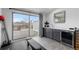 Second floor wet bar area with drink fridge, and sliding glass doors leading to balcony at 3928 Vrain St, Denver, CO 80212