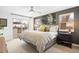 Bright bedroom features neutral carpet, black-out curtains, and balcony access at 3928 Vrain St, Denver, CO 80212