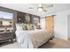 This is a primary bedroom with a king bed, ceiling fan, and sliding barn door at 3928 Vrain St, Denver, CO 80212