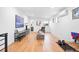 Open floor plan bonus room featuring hardwood floors and lots of natural light at 3928 Vrain St, Denver, CO 80212