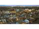Aerial view showcases a residential neighborhood with a beautiful city skyline in the background at 3928 Vrain St, Denver, CO 80212