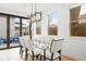 Elegant dining room with a modern glass table and comfortable seating, perfect for gatherings and entertaining at 3928 Vrain St, Denver, CO 80212