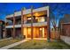 Stunning three-story exterior showcasing brick accents, multiple balconies, and a well-manicured lawn at 3928 Vrain St, Denver, CO 80212