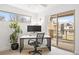Bright home office featuring a modern desk, balcony access and plenty of natural light at 3928 Vrain St, Denver, CO 80212