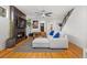 Cozy living room with a fireplace, modern sectional sofa, and stylish decor, creating a comfortable atmosphere at 3928 Vrain St, Denver, CO 80212