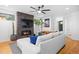 Bright living room with fireplace, contemporary decor, and a spacious layout leading to the entrance and kitchen at 3928 Vrain St, Denver, CO 80212