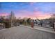 Large rooftop deck offers stunning neighborhood views and the pink and blue of the sunset at 3928 Vrain St, Denver, CO 80212