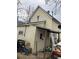 A view of the backyard with a covered patio and a detached garage at 615 E 49Th Ave, Denver, CO 80216
