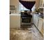 Kitchen with stainless steel oven and overhead microwave at 615 E 49Th Ave, Denver, CO 80216
