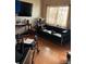Living room featuring leather sofa and wood floors at 615 E 49Th Ave, Denver, CO 80216