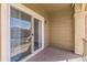 Comfortable balcony with sliding glass doors offering natural light and potential for relaxation at 2215 Calais Dr # G, Longmont, CO 80504
