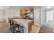 Bright kitchen featuring wooden cabinets, stainless steel appliances, and a convenient breakfast bar with seating at 2215 Calais Dr # G, Longmont, CO 80504