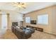 Bright living room with a vaulted ceiling, fireplace, comfortable sofa, and ample natural light through large windows at 2215 Calais Dr # G, Longmont, CO 80504