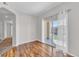 Inviting living room featuring hardwood floors and sliding doors to the patio at 2215 Calais Dr # G, Longmont, CO 80504