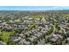 Expansive aerial view of a neighborhood with tree-lined streets and meticulously maintained homes at 11300 Night Heron Dr, Parker, CO 80134