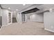 Spacious finished basement with carpet flooring, and stairs leading to the upper level at 11300 Night Heron Dr, Parker, CO 80134