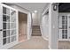 Finished basement with neutral carpet, bright lighting, and easy stair access at 11300 Night Heron Dr, Parker, CO 80134