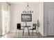 Cozy dining area with modern chandelier and decor, creating an inviting space for meals at 11300 Night Heron Dr, Parker, CO 80134