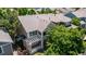 Two-story home featuring a charming front porch, neutral siding, and well-maintained landscaping at 11300 Night Heron Dr, Parker, CO 80134