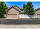 Front exterior of home with tan siding and attached garage at 11300 Night Heron Dr, Parker, CO 80134