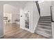 Bright hallway leads to living spaces with staircase access to upper floors at 11300 Night Heron Dr, Parker, CO 80134
