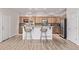 Well-lit kitchen features wood cabinets, stainless steel appliances, and a functional breakfast bar at 11300 Night Heron Dr, Parker, CO 80134