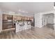 Open kitchen with granite countertops, stainless steel appliances, and breakfast bar seating at 11300 Night Heron Dr, Parker, CO 80134