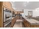 Modern kitchen with stainless steel appliances, granite countertops, and ample cabinet space at 11300 Night Heron Dr, Parker, CO 80134