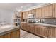 Charming kitchen with ample wood cabinetry, granite countertops, and modern appliances at 11300 Night Heron Dr, Parker, CO 80134
