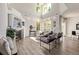 Bright living room with fireplace, modern furniture, and large windows offering plenty of natural light at 11300 Night Heron Dr, Parker, CO 80134