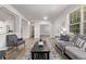 Cozy living room with a neutral color scheme, hardwood floors, and ample natural light at 11300 Night Heron Dr, Parker, CO 80134