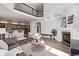 Spacious living room featuring high ceilings, an open floor plan, and a cozy fireplace at 11300 Night Heron Dr, Parker, CO 80134