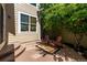 Back patio with two Adirondack chairs and foliage at 11300 Night Heron Dr, Parker, CO 80134