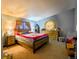 Comfortable bedroom with neutral tones, dresser, and a large window that provides natural light at 15682 Morris Ave, Fort Lupton, CO 80621