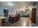 Open concept dining area with modern flooring and view of the backyard at 15682 Morris Ave, Fort Lupton, CO 80621