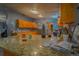 Well-lit kitchen with granite countertops and stainless steel appliances, perfect for cooking at 15682 Morris Ave, Fort Lupton, CO 80621
